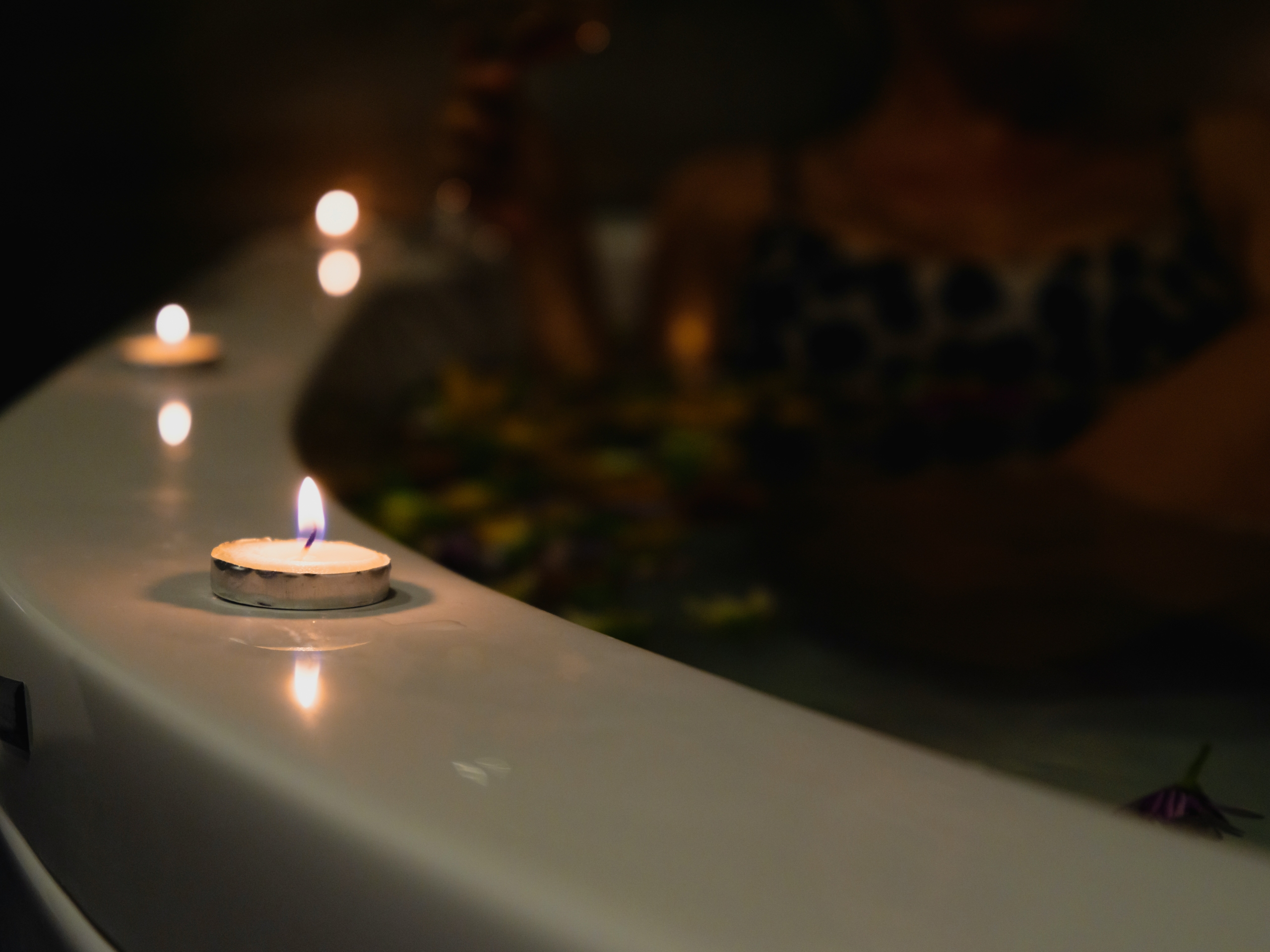 lit candles on tub spa night date night ideas for parents