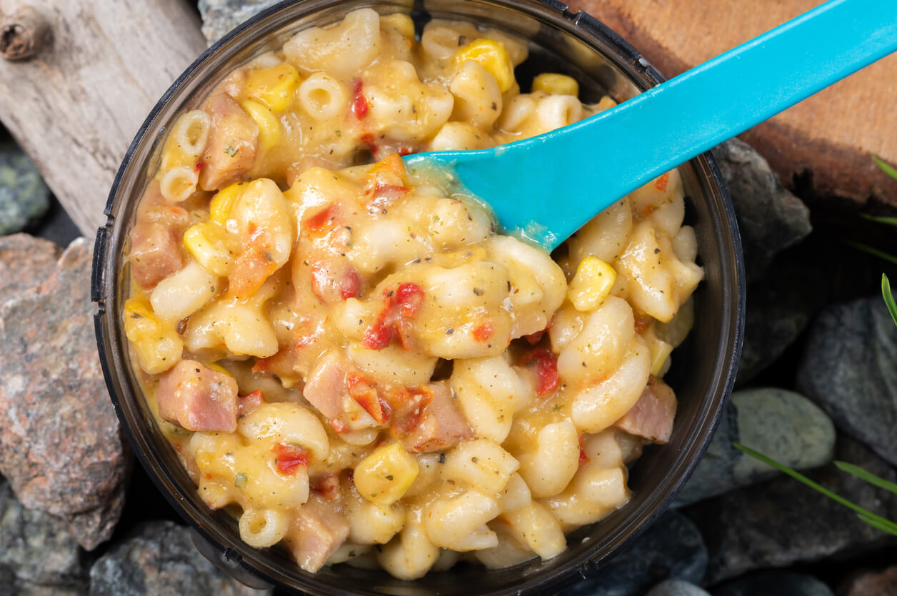 Cooked pasta with meat and corn. Tourist pasta food. Macro photo of food. mac and cheese