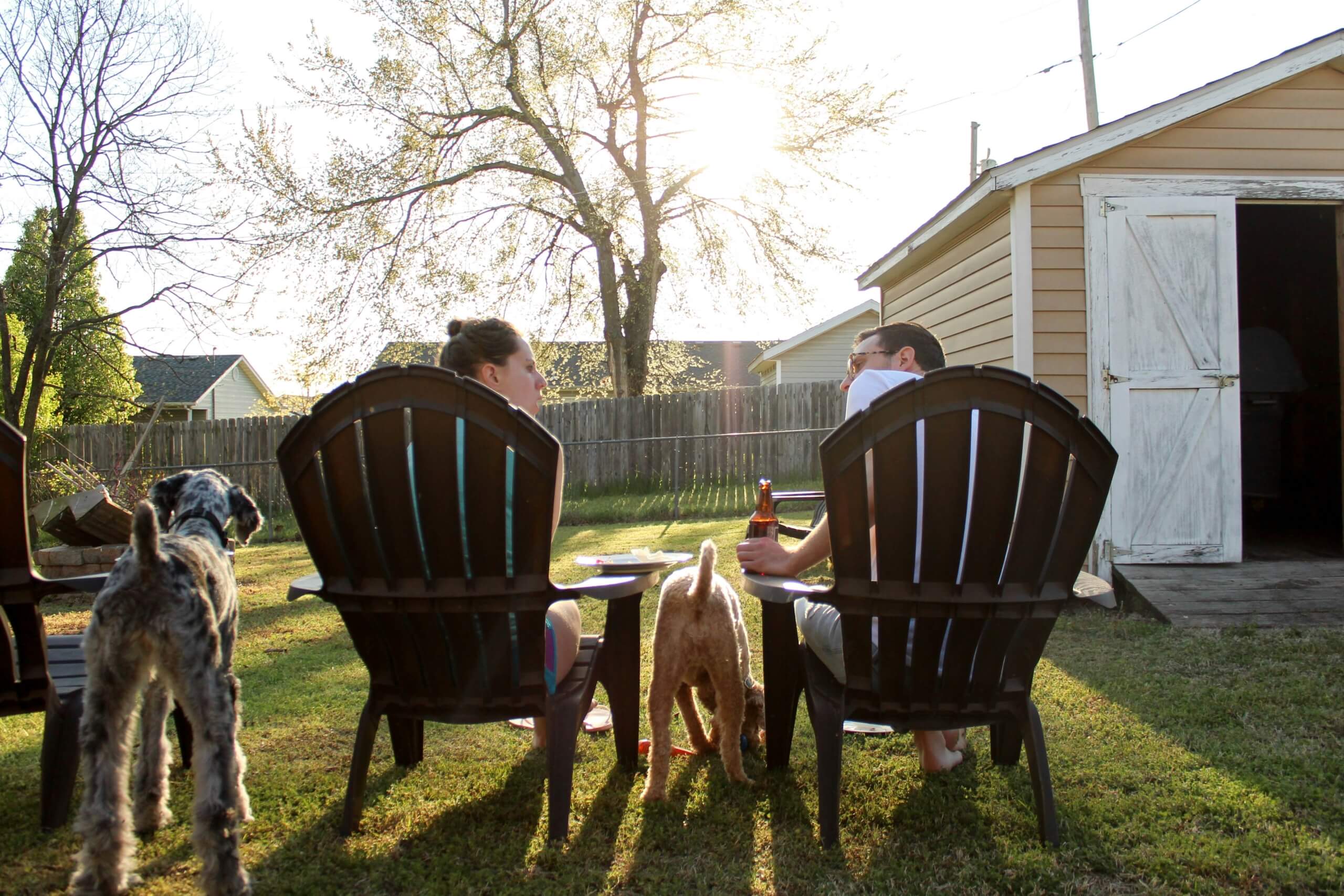 people sitting in the backyard summer backyard refresh ideas