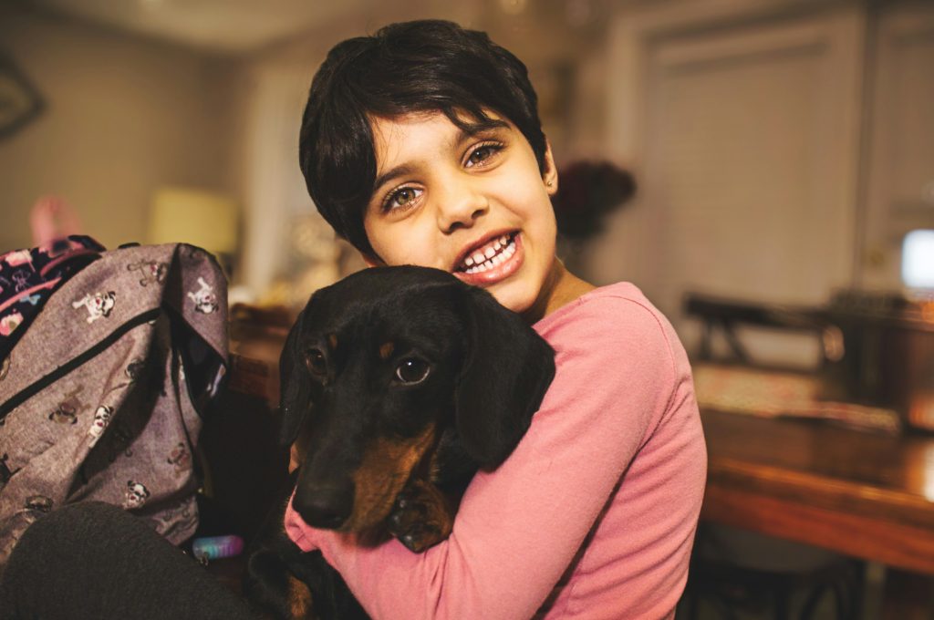 little boy with family dog is a dog dna test worth it