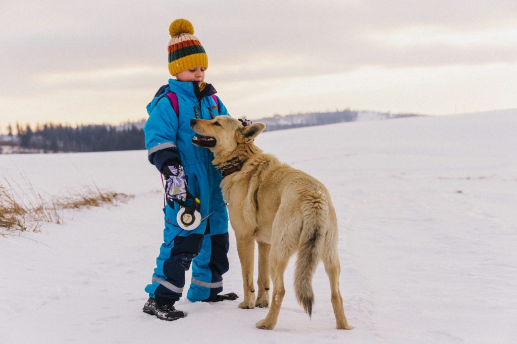 kid and dog outside in the winter Outdoor Time in Winter