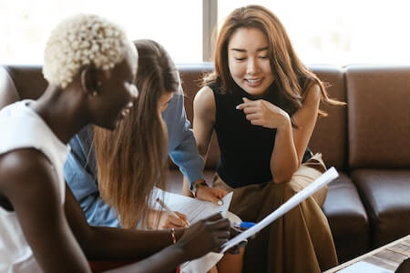 Female colleagues looking at project - fun jobs near me