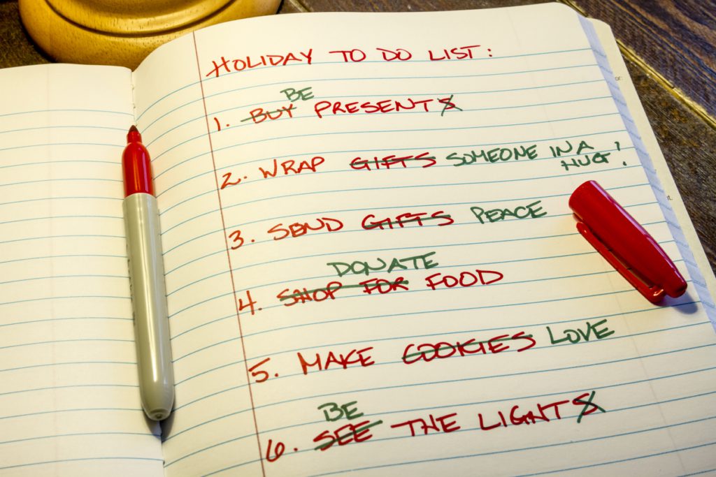 Holiday to do list Holiday to do list written on lined paper in red and green marker sitting under lamp on wooden table Work Life Balance During the Holiday Season
