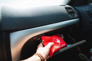 memorial dat road trFirst aid kit is in the glove compartment of the car, first aid on the road during a road trip.
