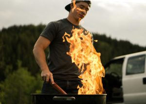 smoked bbq for memorial day.- guy using grill