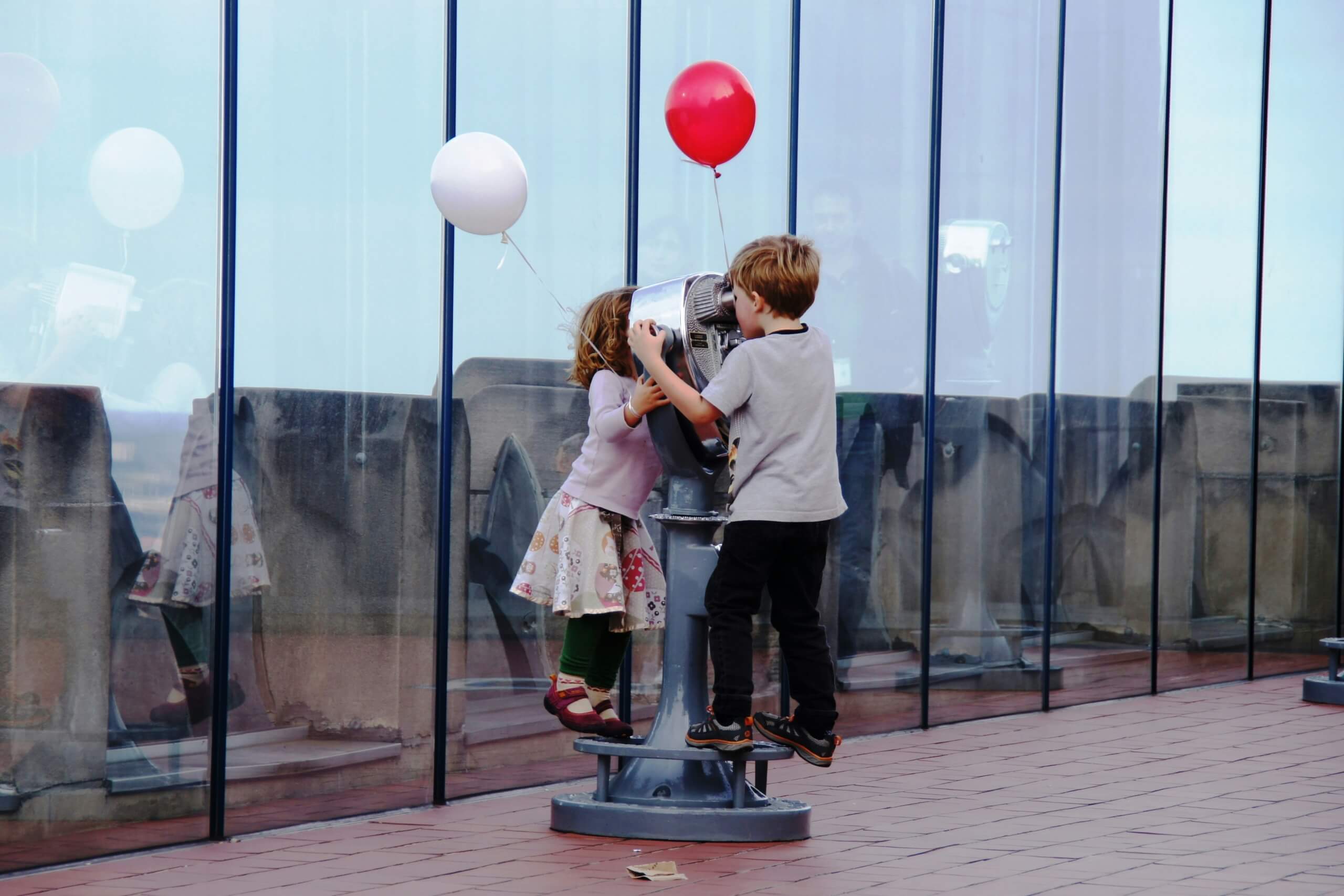 kids looking thru telescope - educational travel experiences