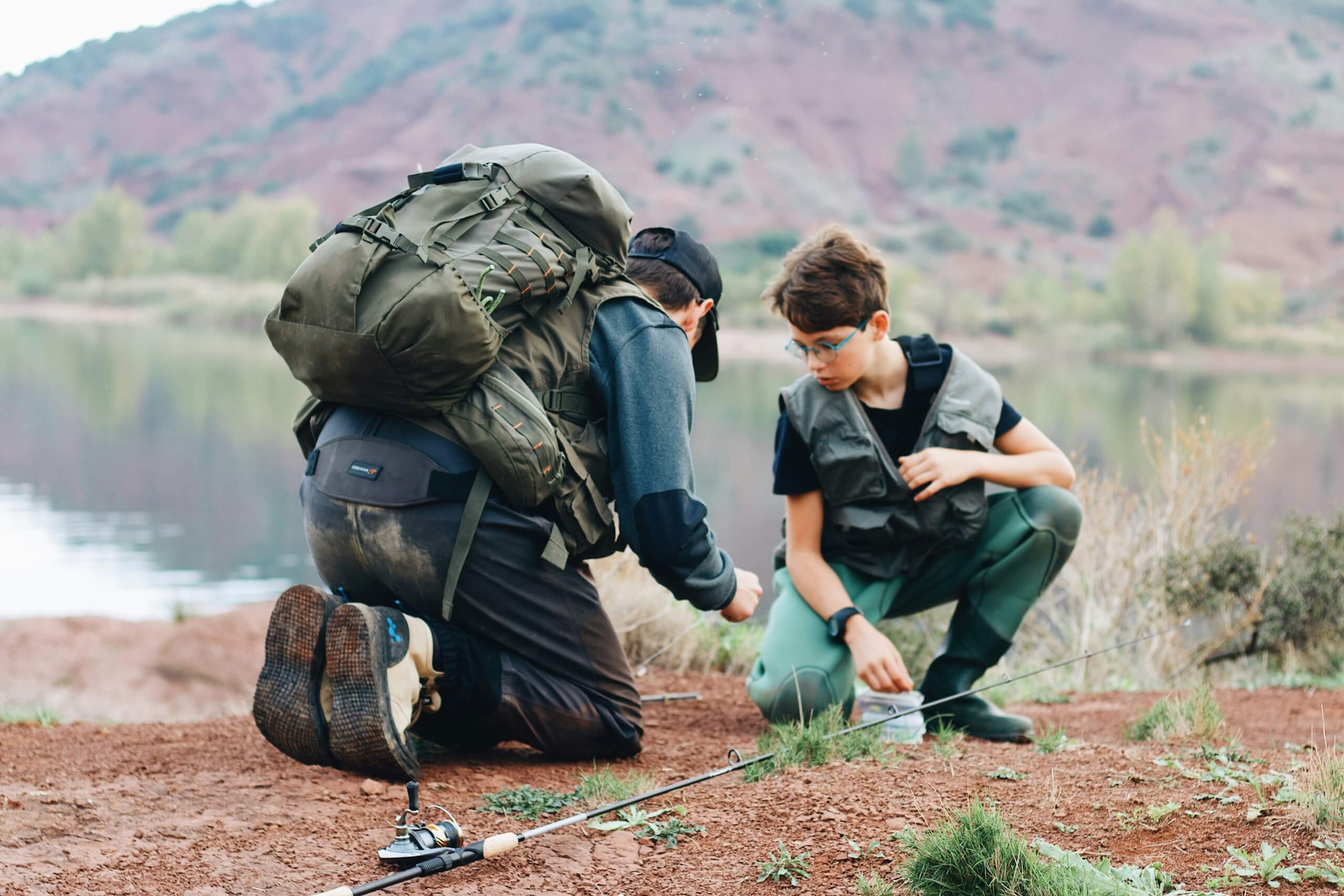 dad and son camping hiking outdoors - educational travel experiences