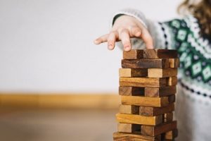 Rainy Day Activities - Kids and parents playing Jenga game