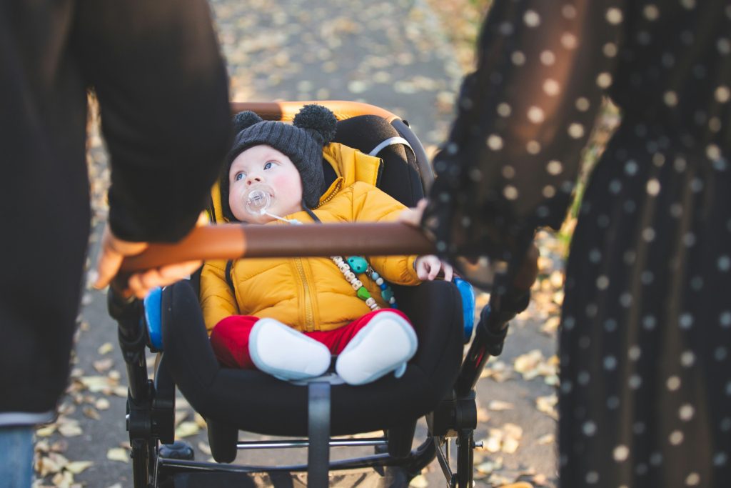 baby in stroller outdoor adventures you can actually do with a newborn