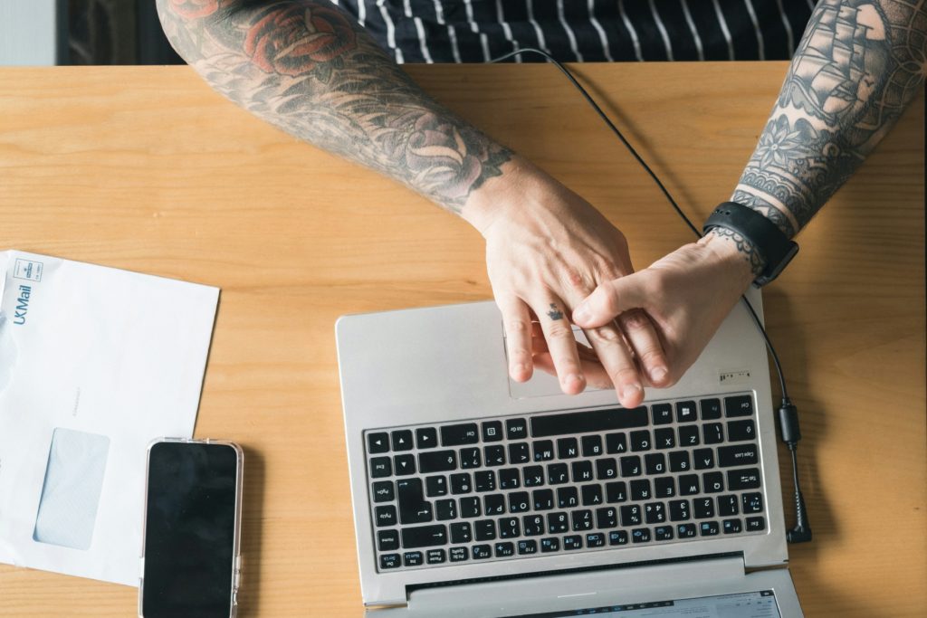man working on laptop Productivity Hacks for Dads