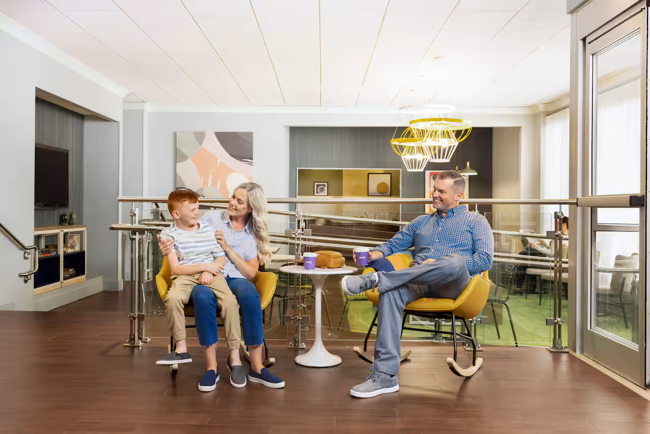 family eating at hilton spark Affordable Family Summer Vacation Ideas 