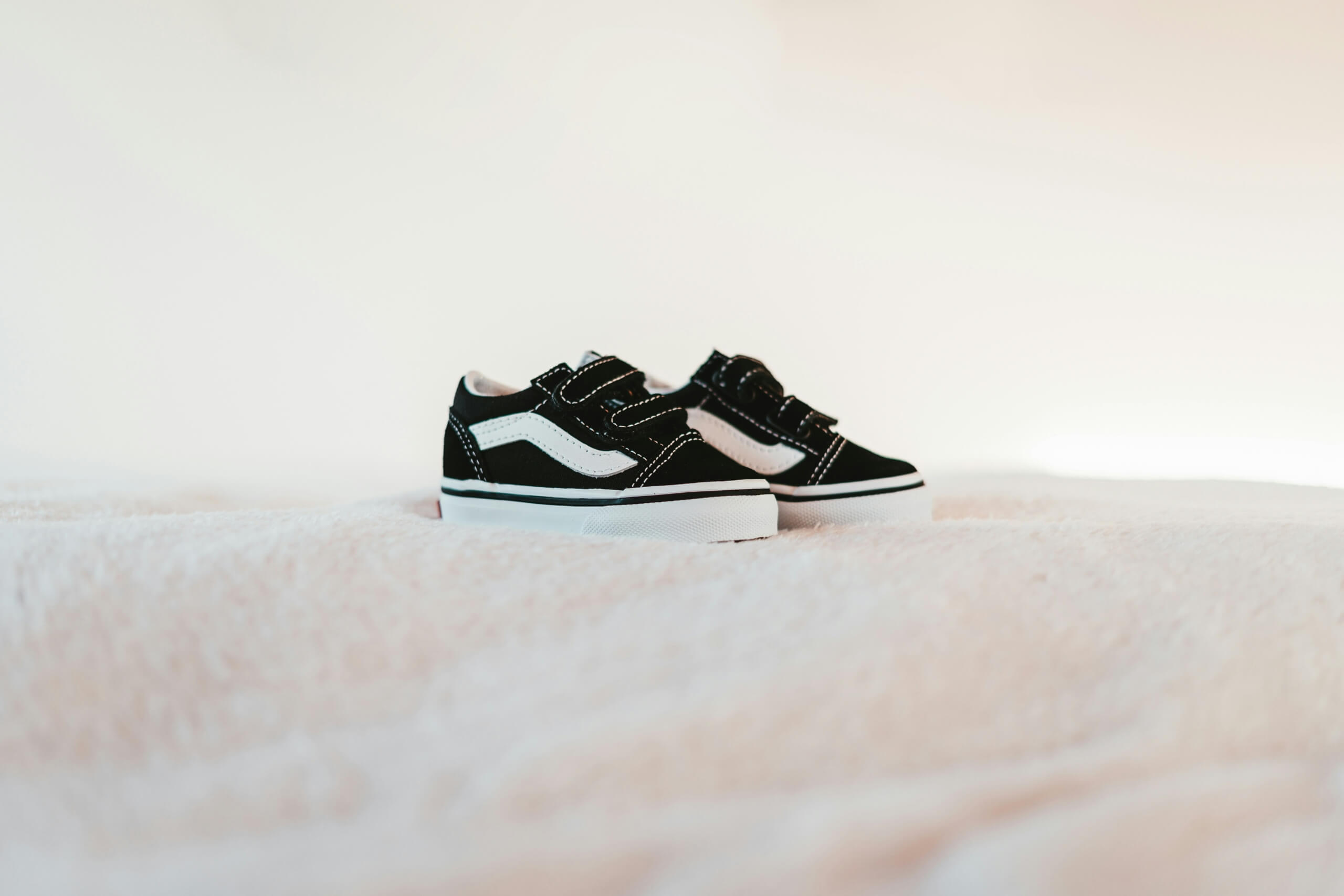 What to Look for When Shopping for Back to School Shoes for Boys Cushioned midsoles: These are vital for absorbing impact and providing comfort while your little one is out and about. Durable outsoles: Look for rubber or reinforced materials that can hold up against scuffs and scrapes.  Breathable uppers: To prevent stinky, sweaty feet, shoes with mesh panels or knit materials will help with air flow and circulation. Secure closures: It doesn’t matter if it's a lace-up system or an elastic strap, having a secure closure is important to keep shoes comfortably in place. Flexible materials: Shoes that move naturally with the foot will reduce strain and prevent injuries while he’s running and playing. Reinforced toe protection: Having that extra bit of durability will extend the life of the shoes while also protecting his toes!