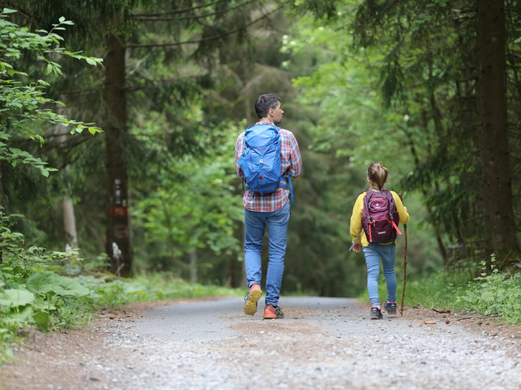 dad and kid going on a walk hiking Family Hiking for Beginners