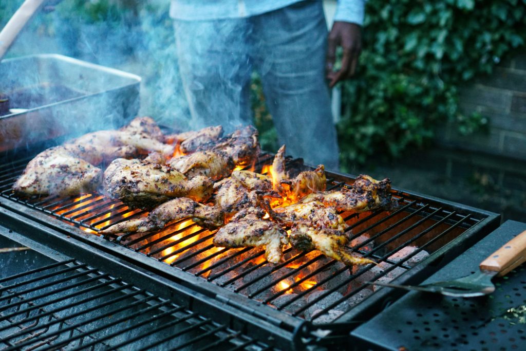 man grilling chicken 