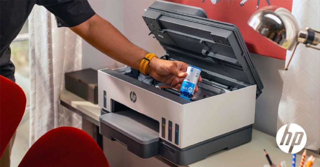 man changing printer cartridge College supplies