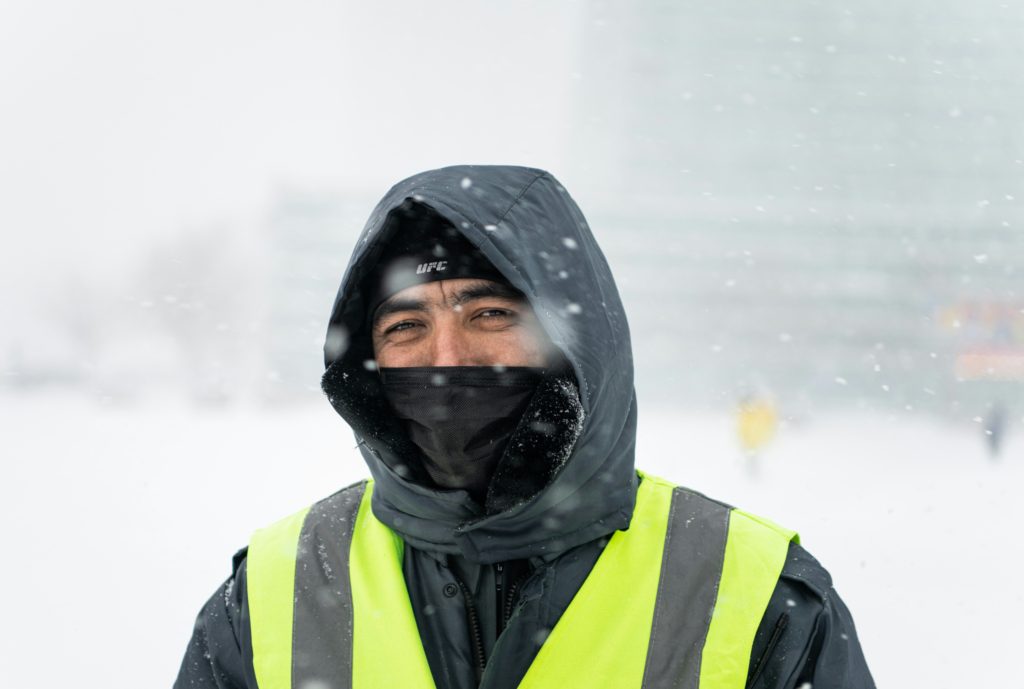 man working outside in the winter winter workwear
