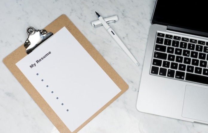 White Printer Paper Beside Silver Laptop Computer - customer success manager resume