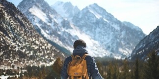 Men's Blue Leather Jacket and Brown Backpack - gifts for nature lovers