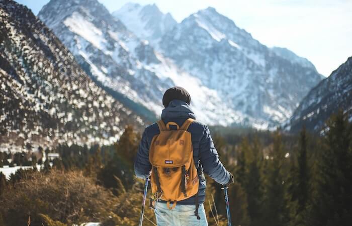 Men's Blue Leather Jacket and Brown Backpack - gifts for nature lovers