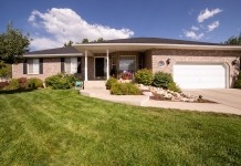 Green Grass Lawn Near White and Brown House Under Blue Sky - front yard hedge ideas
