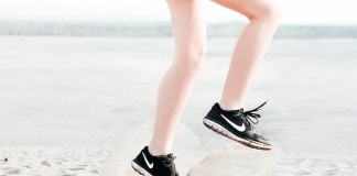Photo of Woman Wearing Pair of Black Nike Running Shoes - best marathon running shoes