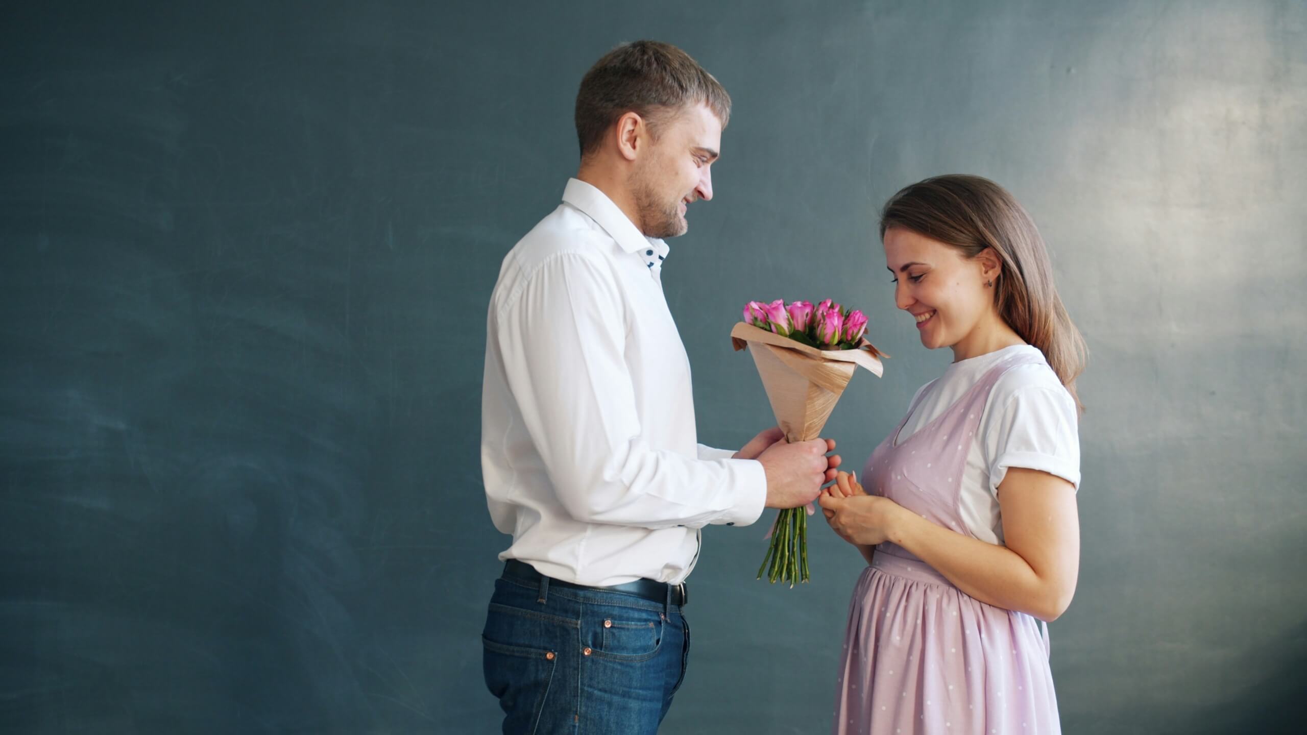 man giving woman gift mother's day gifts from husband