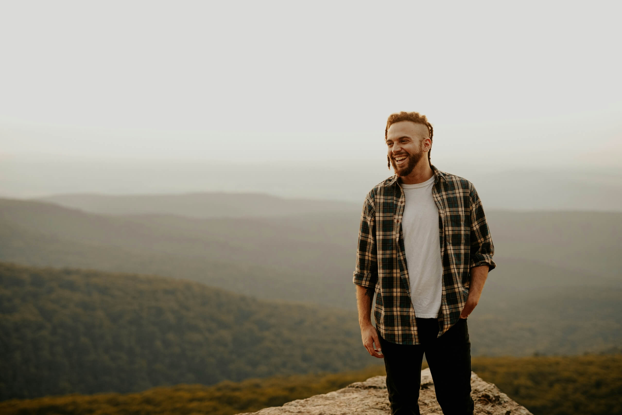 man laughing man hiking outdoors