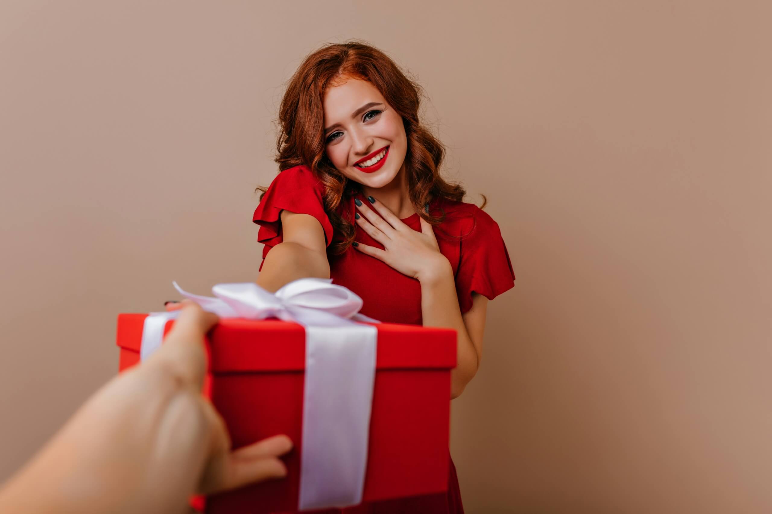 luxury jewelry gifts - woman receiving gift for christmas
