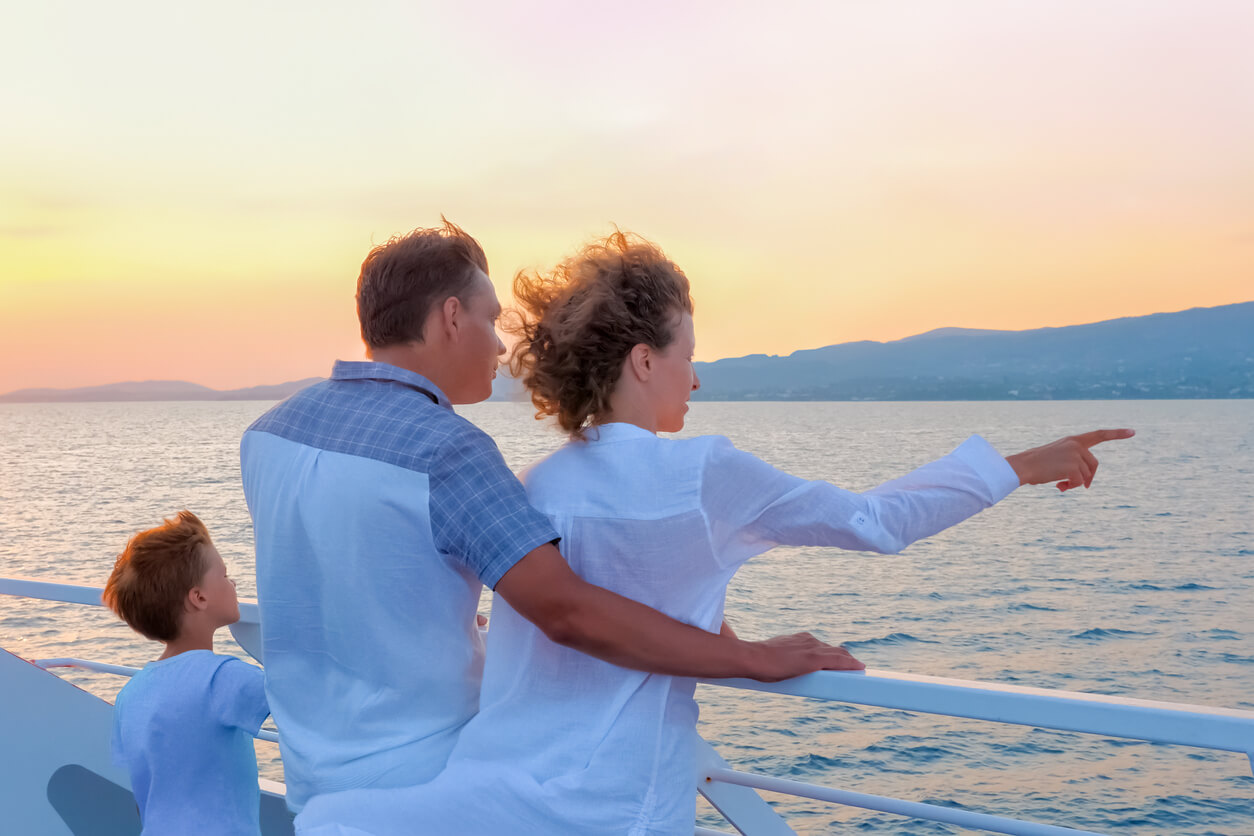 cruising with kids Happy family travels by sea. Family tourism concept. Consumers pinpoint travel. Voyage to Greece. Season stay, short stay of traveling. Woman in white with husband and son on yacht, boat, ship
