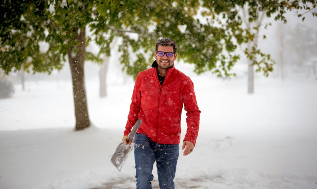 Home Maintenance Checklist for Winter man in snow