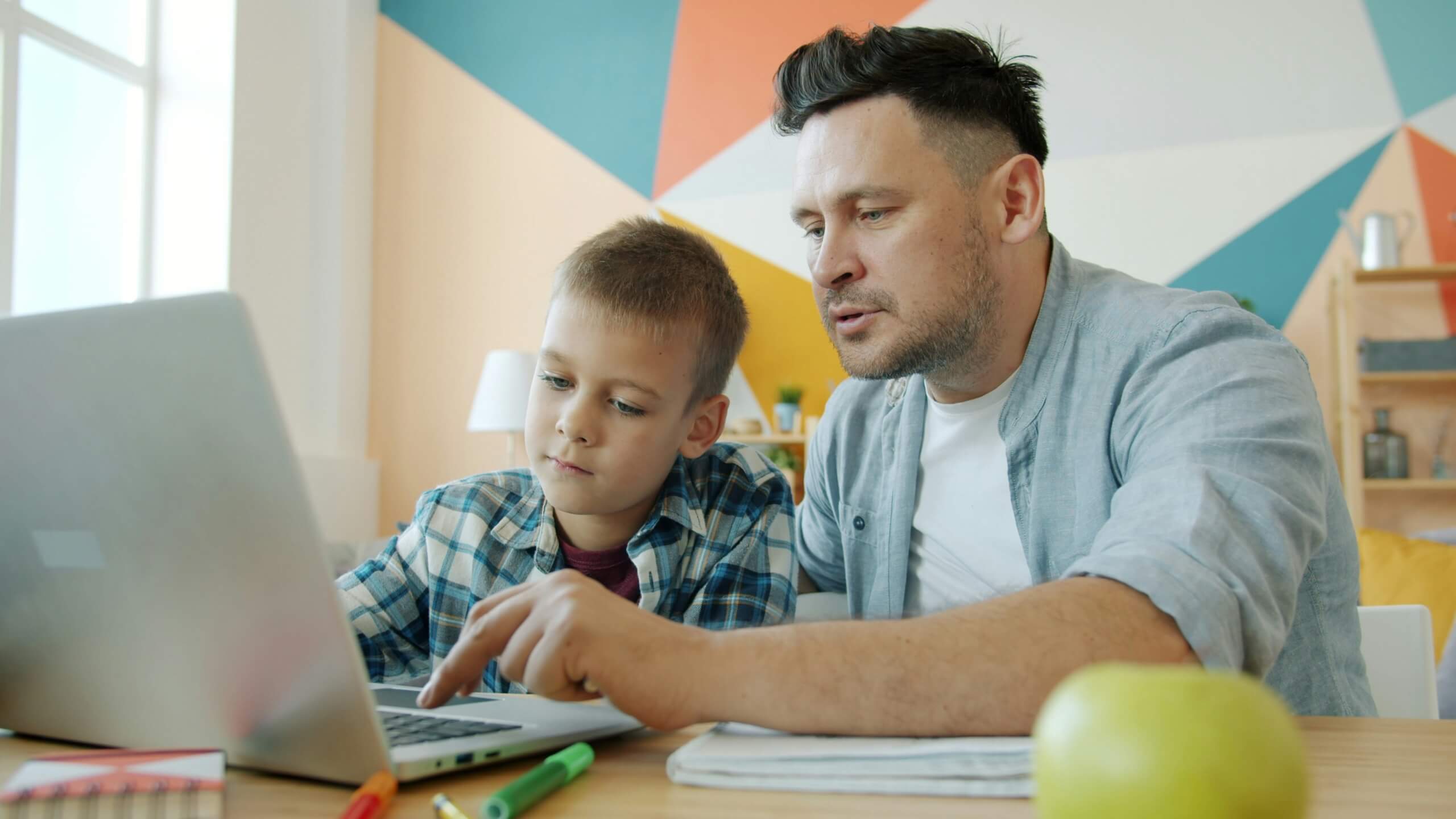 man and son on computer family tax deductions