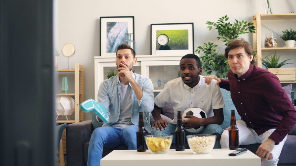 football game watch party Photo by Vitaly Gariev on Unsplash